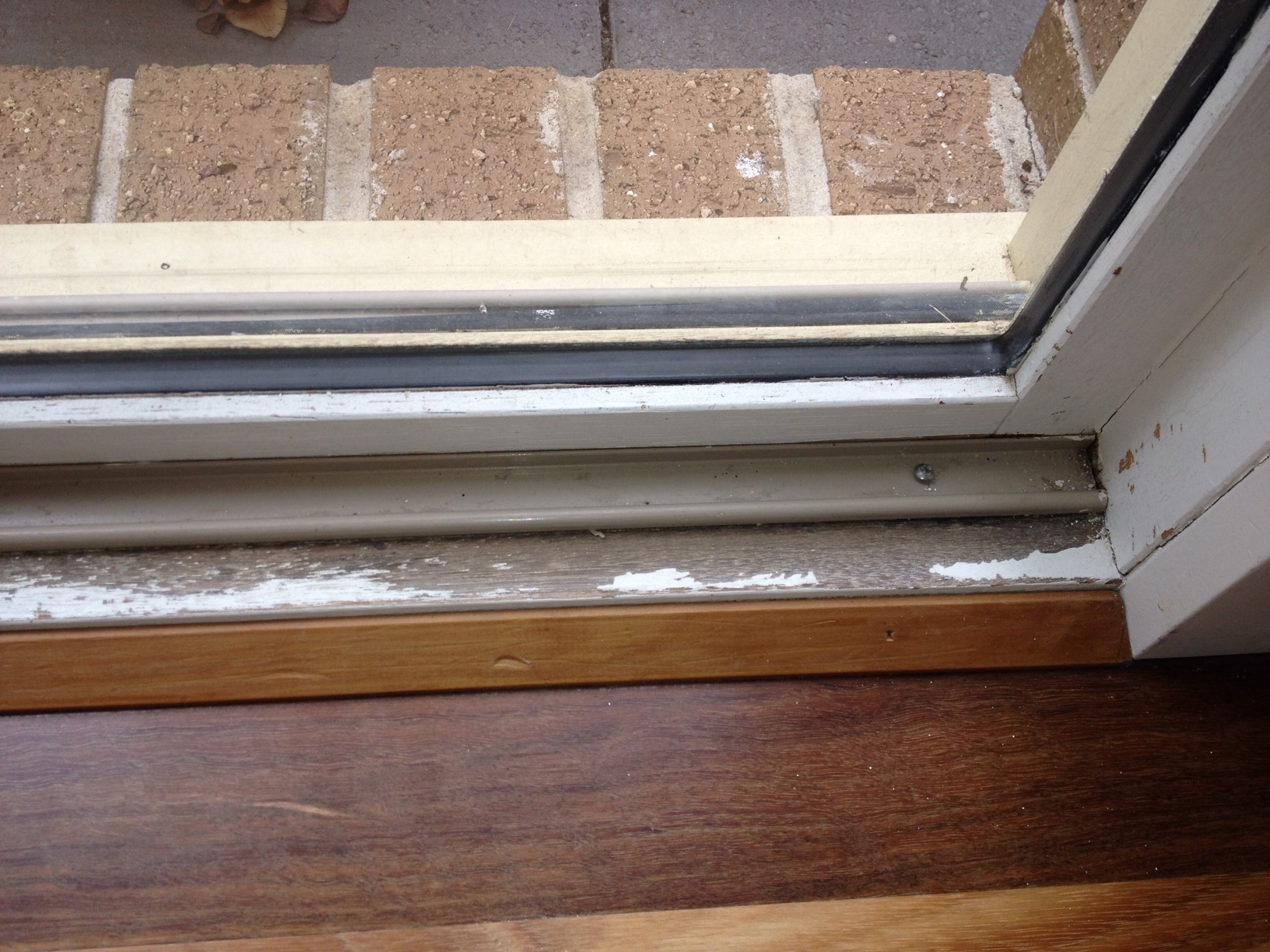 Repairing and repainting a weathered door sill. TMZ Painting Repairing and repainting a weathered door sill. TMZ Painting